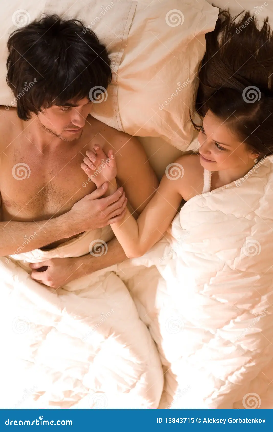 Couple relaxing together under a blanket